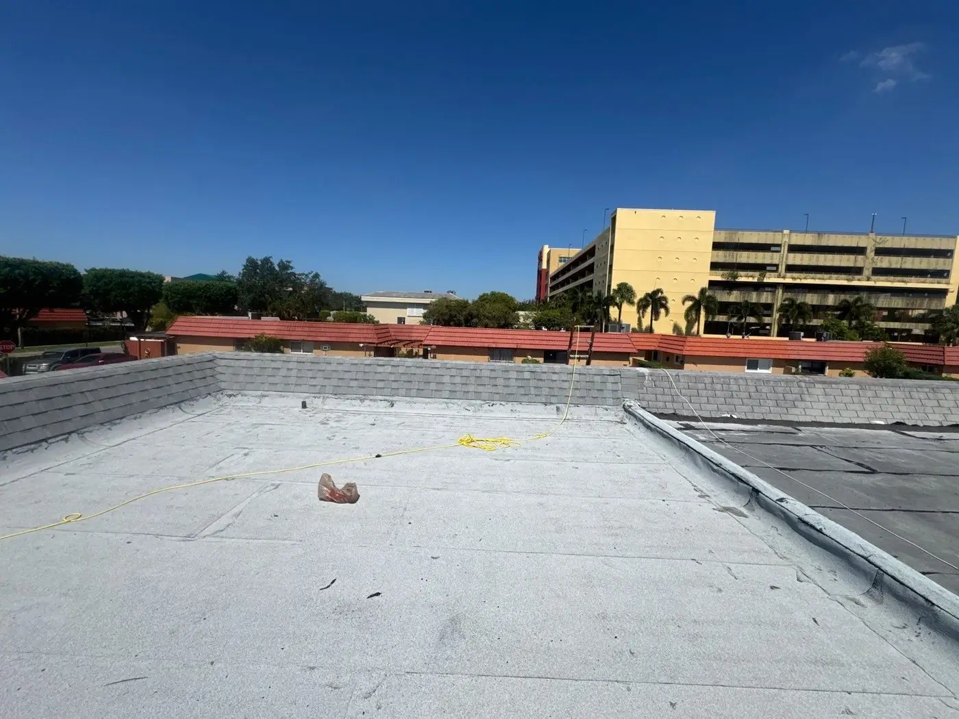 Flat roof silicone coating on a Country Club commercial building